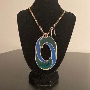 Long JJ necklace with green and blue pendant.